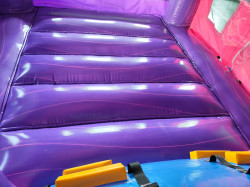 PINK AND PURPLE BOUNCE HOUSE WITH SLIDE